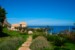 THE VILLA WITH ITS BEAUTIFUL PANORAMA AND A PART OF THE GARDEN